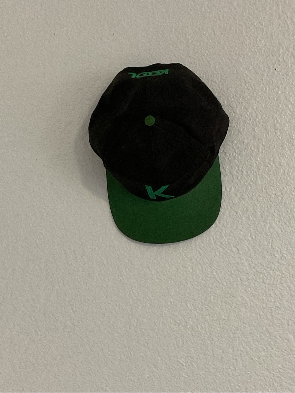 Black and Green Baseball Cap with 'K' Accent